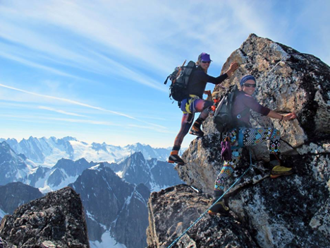 Women rockclimbing together and reaching new heights in their careers and lives